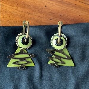 Metal and green hoop earrings.